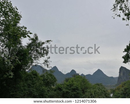 Many trees and mountains in China.