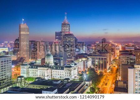 Indianapolis, Indiana, USA downtown city skyline with the State House at dusk.