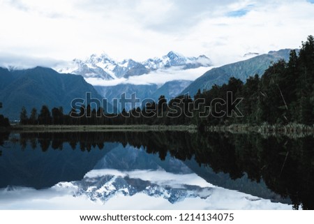 Beautiful landscape of the mountain and the reflection on the lake. Lake Matheson, Fox Glacier, New Zealand.