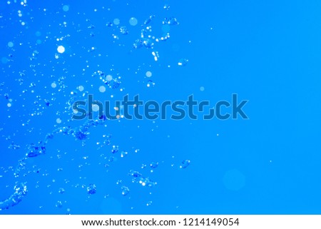 Abstract splash of water isolated on a blue background.Beautiful a clean water.