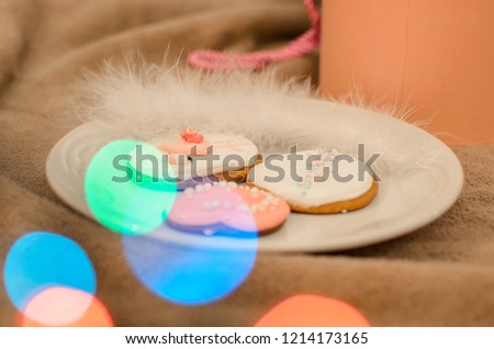 New Year wonderful tender pink and white cookies with flamingo picture  under a Christmas tree