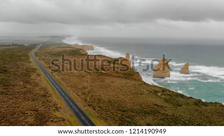 The Great Ocean Road along Twelve Apostles, Australia aerial view on a stormy day.