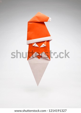 A  PAPER SANTA CLAUS MADE USING THE ART OF ORIGAMI 