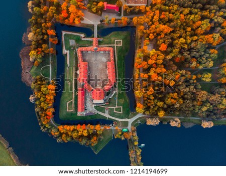Aerial photo Nesvizh castle in autumn evening, Belarus Minsk, top view