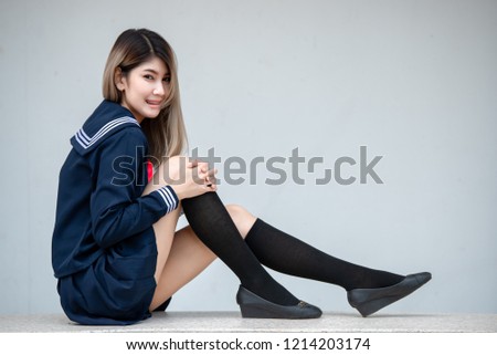 Portrait of asian woman wear student dress japan style,Thailand people,Cute girl pose for take a picture,Lifestyle of modern woman
