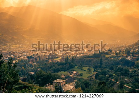 city ​​aerial panorama at sunset. City taken from the mountain