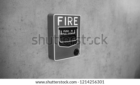 BLack and white picture of Emergency of Fire alarm system notifier or alert or bell warning equipment use when on fire (Manual Pull Station).