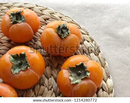 Ripe persimmon fruits. High resolution photography.