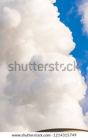 Water vapour rises from a cooling tower