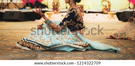 Indian Pakistani bride dance in wedding.