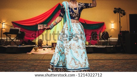Indian Pakistani bride dance in wedding.