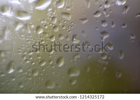 Drops of water on the crooked glass, shallow dof. Selective focus.