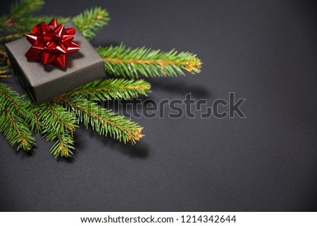 Christmas tree and gifts on gray background. Christmas holidays background with copy space for your text