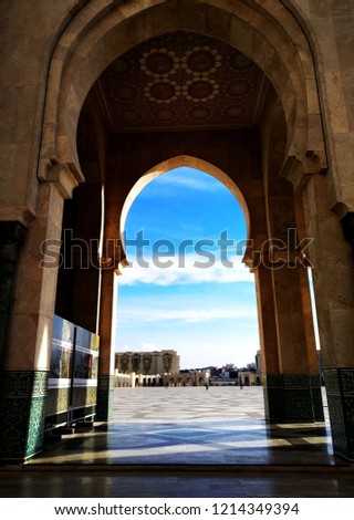 Casablanca ,Morocco - The Hassan II Mosque beautiful stunning arch terrace in sunny day, seeing the bright blue sky as background. 