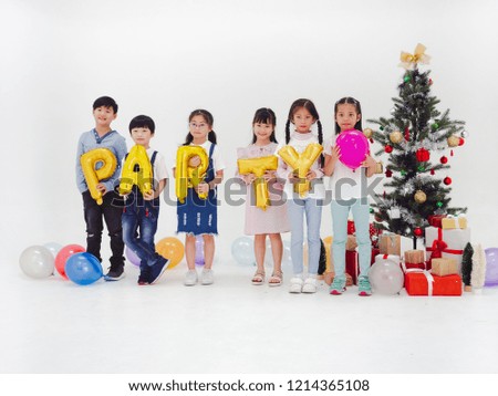 group of kids celebrate party and enjoy christmas fun together