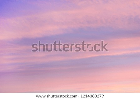Sunset or Sunrise Sky of Soft Pink, Purple and Blue Colors. Beautiful Empty Sky Background at Dusk or Dawn with Small Clouds and Natural Light. Abstract Poster and Scenic Cloudscape Wallpaper