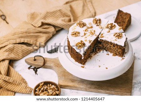 Carrot Cake with Cream Cheese Icing and walnut. Vegan and gluten free concept