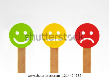 Green, yellow and red faces with positive, neutral and negative expression