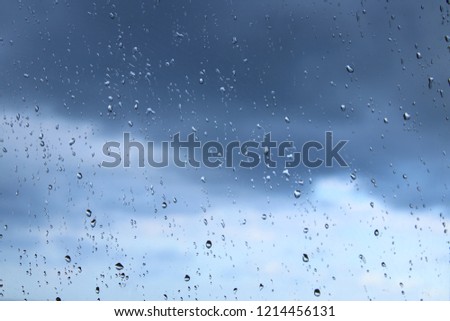 background of rain water drop on glass, bad winter weather