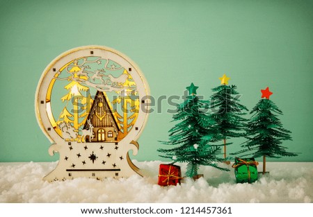 Image of paper christmas trees over white snow