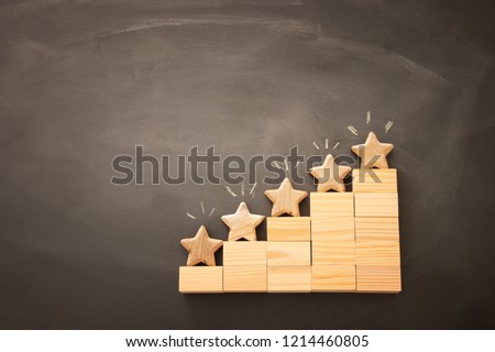 concept image of setting a five star goal. increase rating or ranking, evaluation and classification idea. Top view. Flat lay Royalty-Free Stock Photo #1214460805