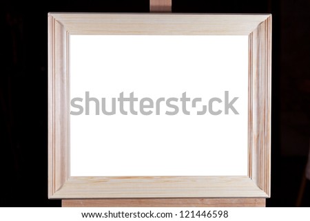 simple wide wooden picture frame with white cut out canvas