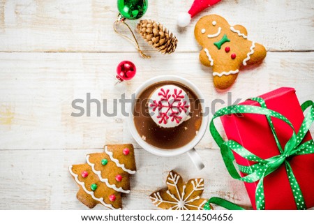 Christmas hot beverage ideas, girl drinking hot chocolate with marshmallow decorate with snowflake, hands in the picture, top view, copy space, with christmas decorations