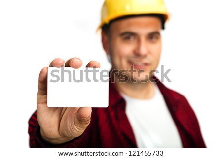 Construction worker holding blank business card, business introduction concept.