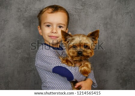 Boy with yorkshire terrier dog