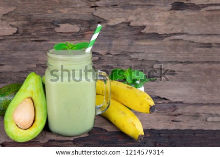 avocado mix banana smoothies green colorful fruit juice milkshake blend beverage healthy high protein the taste yummy In glass,drink episode morning on a wooden background.