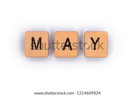 MAY, spelt with wooden letter tiles over a plain white background. 