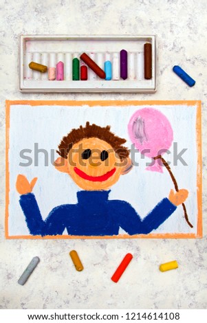 Colorful drawing: Smiling boy with pink balloon in his hand