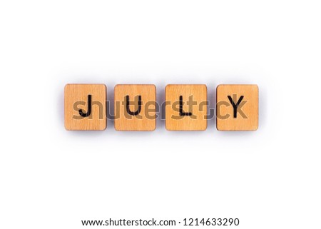JULY, spelt with wooden letter tiles over a plain white background. 