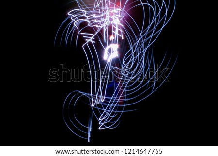 abstract colored lines drawn by light on a black background photography freezelight