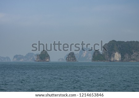 Beautiful limestone mountain scenery panorama of Ha Long Bay, North Vietnam. Cloudy winter weather
