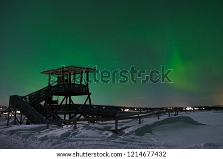tower near the river, northern lights in the north of Finland, life in Lapland, cold winter night 