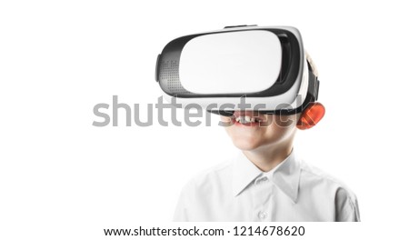 child in virtual reality mask is isolated on white background, boy in shirt plays. vr 360 vision goggles enjoying video game isolated on clear background in innovation and gaming technology concept.
