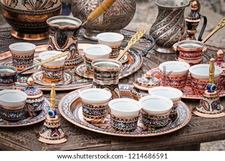 Traditional handmade souvenir from Bosnia and Herzegovina - turkish coffee pot with small copper cups