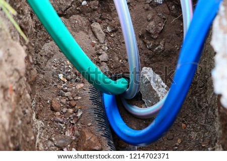 Fiber optic internet cables being installed underground. 