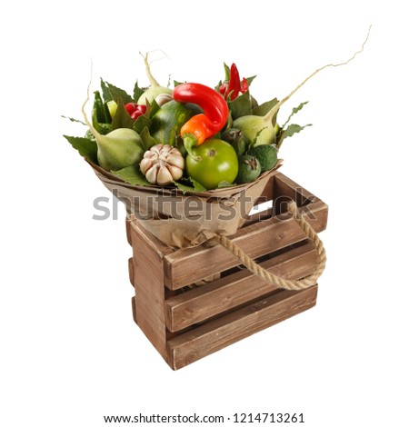 Bunch of fresh vegetables in a wooden box as a gift