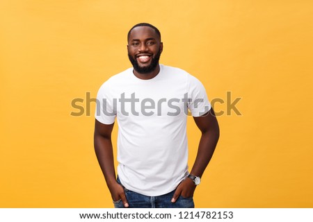 Portrait of delighted African American male with positive smile, white perfect teeth, looks happily at camera, being successful enterpreneur, wears white t shirt. Royalty-Free Stock Photo #1214782153
