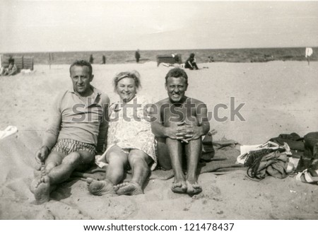 Vintage photo of family on beach (sixties)