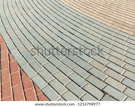 Sidewalk tile. Close-up paving slabs by mosaic. Road paving, construction. Colored concrete paving slab. Diagonal.