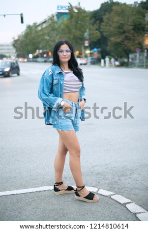 Fashion girl posing on street 