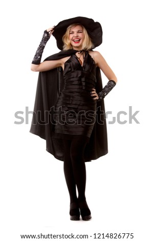 Full-length photo of happy witch blonde in black hat