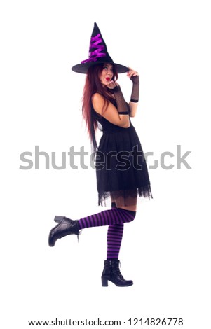 Picture of witch brunette in black dress and hat