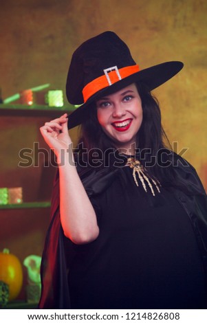 Portrait of smiling witch in hat