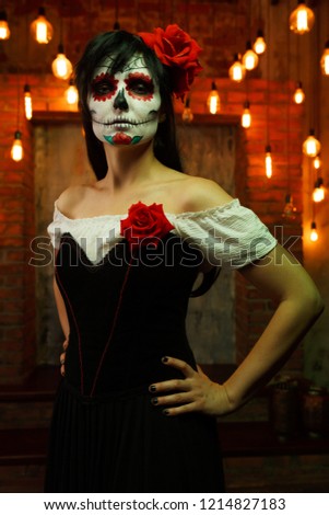 Image of halloween woman with white make-up on her face