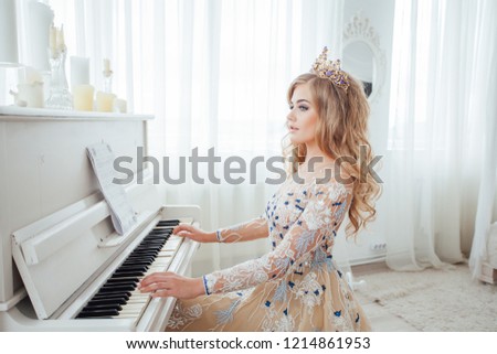 beautiful girl plays a piano