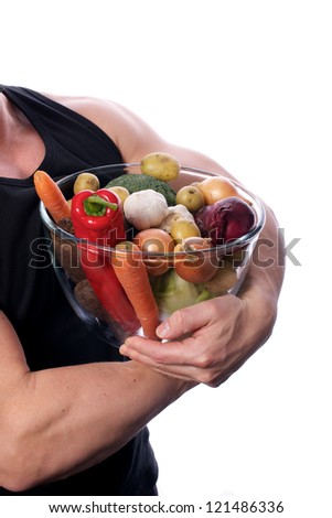 Picture of a fit, muscular body holding vegetables, on a white, isolated background